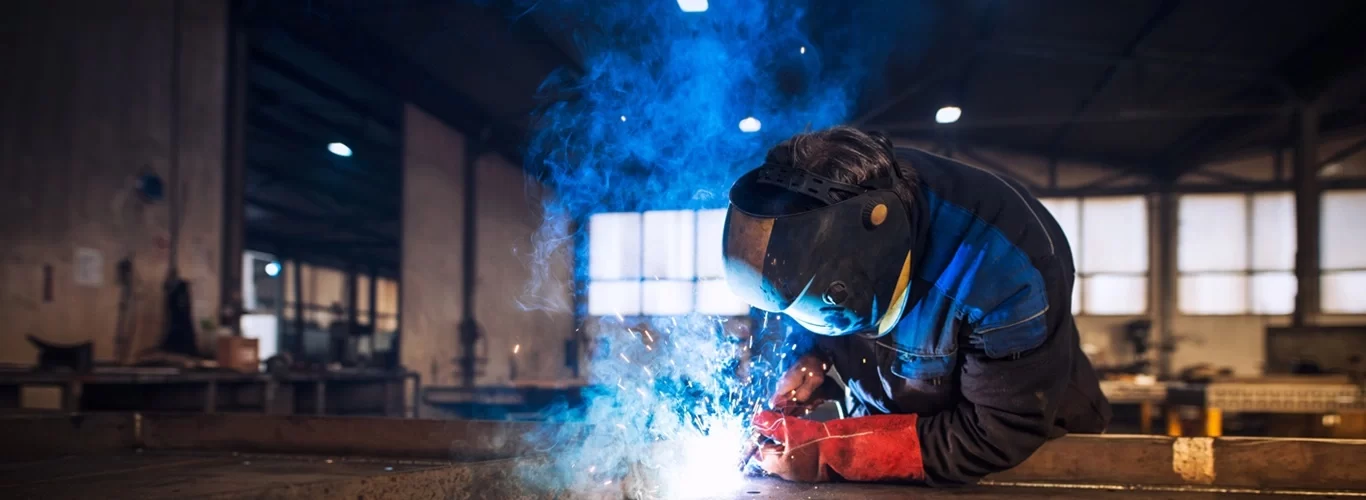 close-up-view-worker-welding-metal-construction-industrial-workshop