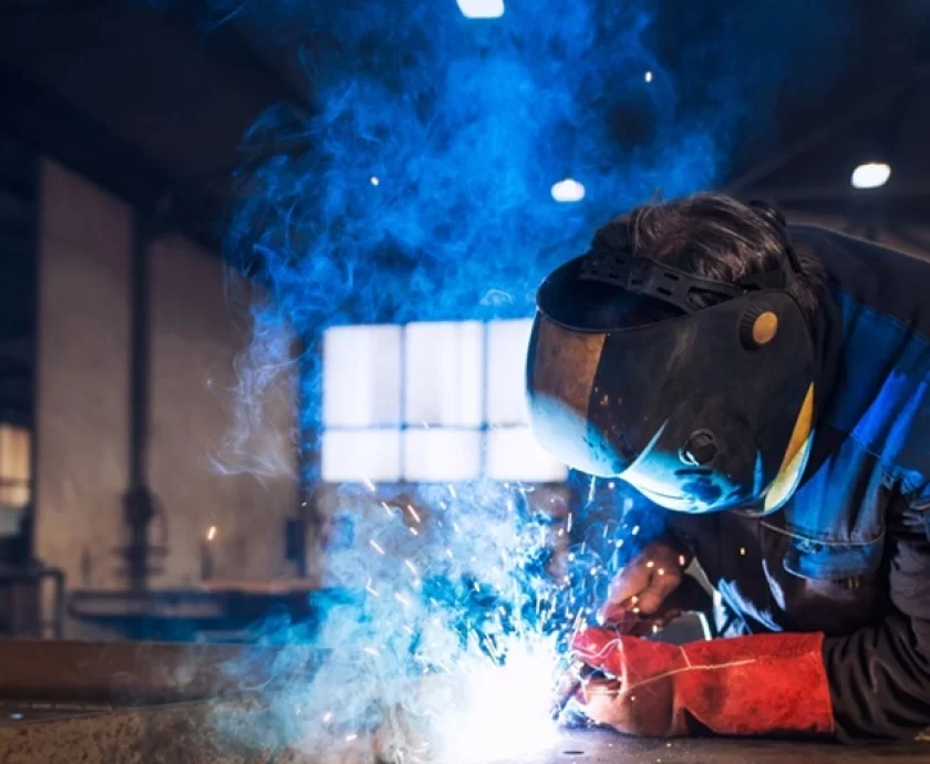 close-up-view-worker-welding-metal-construction-industrial-workshop